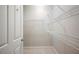 Walk-in closet with adjustable wire shelving and tile floors at 2997 Mission Lakes Dr, Lakeland, FL 33803