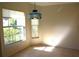 Light and airy dining room with decorative chandelier and large windows to view the outdoors at 3817 Osprey Pointe Cir, Winter Haven, FL 33884