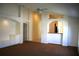 View of living room featuring neutral paint, archways, and a kitchen pass through at 3817 Osprey Pointe Cir, Winter Haven, FL 33884