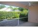 Screened patio offers views of the lush backyard landscaping at 3817 Osprey Pointe Cir, Winter Haven, FL 33884