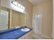 Bathroom featuring a bright vanity with a large mirror and modern fixtures at 4069 Byrds Crossing Dr, Lakeland, FL 33812