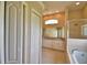 Elegant bathroom with double sinks, large mirror, and a separate tub and shower area at 4069 Byrds Crossing Dr, Lakeland, FL 33812