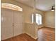 Open entryway featuring wood floors, high ceilings, and natural light streaming through the window at 4069 Byrds Crossing Dr, Lakeland, FL 33812