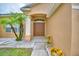 Attractive front entrance with double doors, decorative columns, and colorful landscaping at 4069 Byrds Crossing Dr, Lakeland, FL 33812