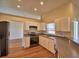 Modern kitchen with stainless steel appliances, white cabinets, and updated countertops at 4069 Byrds Crossing Dr, Lakeland, FL 33812