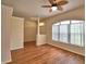 Inviting living room featuring hardwood floors, high ceilings, and a large window at 4069 Byrds Crossing Dr, Lakeland, FL 33812