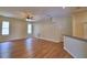 Bright and spacious living room featuring hardwood floors, ceiling fan and ample natural light at 4069 Byrds Crossing Dr, Lakeland, FL 33812