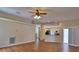 Spacious living room with beautiful laminate floors, lots of natural light and seamless transition to the kitchen area at 4069 Byrds Crossing Dr, Lakeland, FL 33812