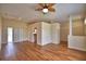Spacious living room with wood floors, a ceiling fan, and sliding glass doors to the backyard at 4069 Byrds Crossing Dr, Lakeland, FL 33812