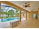Covered patio overlooking the pool, featuring ceiling fans and ample space for outdoor entertaining at 4069 Byrds Crossing Dr, Lakeland, FL 33812