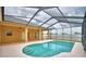 Sparkling pool with screened lanai offers a refreshing outdoor oasis at 4069 Byrds Crossing Dr, Lakeland, FL 33812