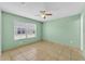 Bedroom with neutral tile flooring and a large window at 517 Sandstone St, Lakeland, FL 33809