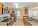 Modern kitchen with stainless steel appliances and granite countertops at 517 Sandstone St, Lakeland, FL 33809