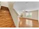 Open living room and stairs feature wood-look flooring and natural light at 517 Sandstone St, Lakeland, FL 33809