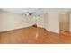 Open living space with hardwood floors and neutral wall paint at 517 Sandstone St, Lakeland, FL 33809