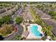 Expansive aerial view of the neighborhood showcasing the pool, landscaping, and parking at 5407 River Rock Rd # 5407, Lakeland, FL 33809