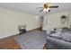 Relaxing living room with a comfortable couch, stylish rug, and wall-mounted TV at 5407 River Rock Rd # 5407, Lakeland, FL 33809