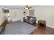 Bright living room featuring hardwood floors, a ceiling fan, and neutral decor at 5407 River Rock Rd # 5407, Lakeland, FL 33809