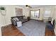 Inviting living room boasts hardwood floors, ceiling fan, and plentiful natural light at 5407 River Rock Rd # 5407, Lakeland, FL 33809