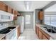 A well-lit kitchen features ample countertop space, white appliances, and wood-tone cabinetry at 5458 Quarry Rock Rd, Lakeland, FL 33809