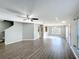 Spacious living room boasting updated wood floors and a ceiling fan at 5458 Quarry Rock Rd, Lakeland, FL 33809