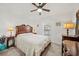 Traditional bedroom featuring a ceiling fan, carpeted floors, and wooden furniture at 5543 Arlington River Dr, Lakeland, FL 33811