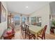 Bright dining room with wood floors, classic furniture, and sliding glass doors for indoor-outdoor flow at 5543 Arlington River Dr, Lakeland, FL 33811