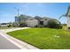 Single-story home with a neat lawn, complemented by vibrant landscaping and a two-car garage at 5543 Arlington River Dr, Lakeland, FL 33811