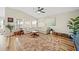 Cozy living room featuring a neutral sectional, hardwood floors, and bright natural light at 5543 Arlington River Dr, Lakeland, FL 33811