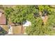 Overhead shot of a home surrounded by mature trees at 605 Forrest Dr, Bartow, FL 33830