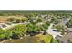 Overhead view of residential neighborhood with mature trees, lakes and cul-de-sac streets at 6775 Lake Clark Dr, Lakeland, FL 33813