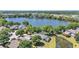 Lakeside residential neighborhood with mature landscaping and nearby commercial district at 6775 Lake Clark Dr, Lakeland, FL 33813