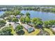 Aerial view of home and lake, showing lush greenery and neighborhood landscape at 6775 Lake Clark Dr, Lakeland, FL 33813