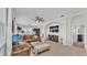 Inviting living room with neutral walls, tile floors, and a large decorative fireplace at 6775 Lake Clark Dr, Lakeland, FL 33813