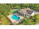 Community pool area with tennis court and clubhouse at 6775 Lake Clark Dr, Lakeland, FL 33813