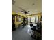 Bedroom with yellow walls, a ceiling fan, electronic drums, and a bay window at 8181 Bristol Bay Ave, Lakeland, FL 33810