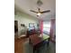 Dining room with wood furniture, hardwood floors, and natural light from a window at 8181 Bristol Bay Ave, Lakeland, FL 33810