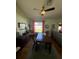 Dining room with wood furniture, hardwood floors, a ceiling fan, and plenty of natural light at 8181 Bristol Bay Ave, Lakeland, FL 33810