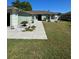 Lush landscaping and a paved walkway enhance this home's curb appeal, welcoming you to a cozy residence at 8181 Bristol Bay Ave, Lakeland, FL 33810