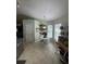 Eat-in kitchen features a white table, chairs, and a pot rack with hanging pots at 8181 Bristol Bay Ave, Lakeland, FL 33810