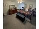 Comfortable bedroom features floral bedding, dresser, and neutral carpet at 8181 Bristol Bay Ave, Lakeland, FL 33810