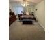 Comfortable bedroom features floral bedding, dresser, and neutral carpet at 8181 Bristol Bay Ave, Lakeland, FL 33810