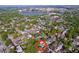 Overhead view of a neighborhood with tree-lined streets, showcasing the property's location near a lake and urban center at 923 Lexington St, Lakeland, FL 33801