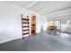 Spacious dining room featuring hardwood floors, minimalist decor, and a connecting room for easy access and entertaining at 923 Lexington St, Lakeland, FL 33801