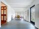 Inviting dining area with hardwood floors, bright white walls, and a decorative door, perfect for Gathering meals at 923 Lexington St, Lakeland, FL 33801