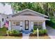 Charming single-story home with a craftsman-style design, featuring a well-manicured front yard and welcoming entrance at 923 Lexington St, Lakeland, FL 33801