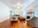 Cozy living room with hardwood floors, a decorative fireplace, and built-in bookshelves, perfect for relaxation at 923 Lexington St, Lakeland, FL 33801