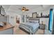 Relaxing bedroom with neutral tones, ceiling fan, and access to the en-suite bathroom at 955 Hunters Meadow Ln, Lakeland, FL 33809