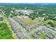 A lovely aerial perspective showcases homes nestled in lush landscapes near local school at 140 Heritage Park Ln, Mulberry, FL 33860