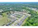 Birds eye view showcases neighborhood homes surrounded by lush greenery at 140 Heritage Park Ln, Mulberry, FL 33860